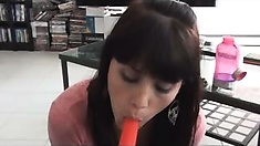 Hailey blows a popsicle
