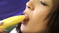 Licking her vibrator