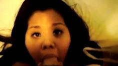 Asian slut sucks and receives cum on her face